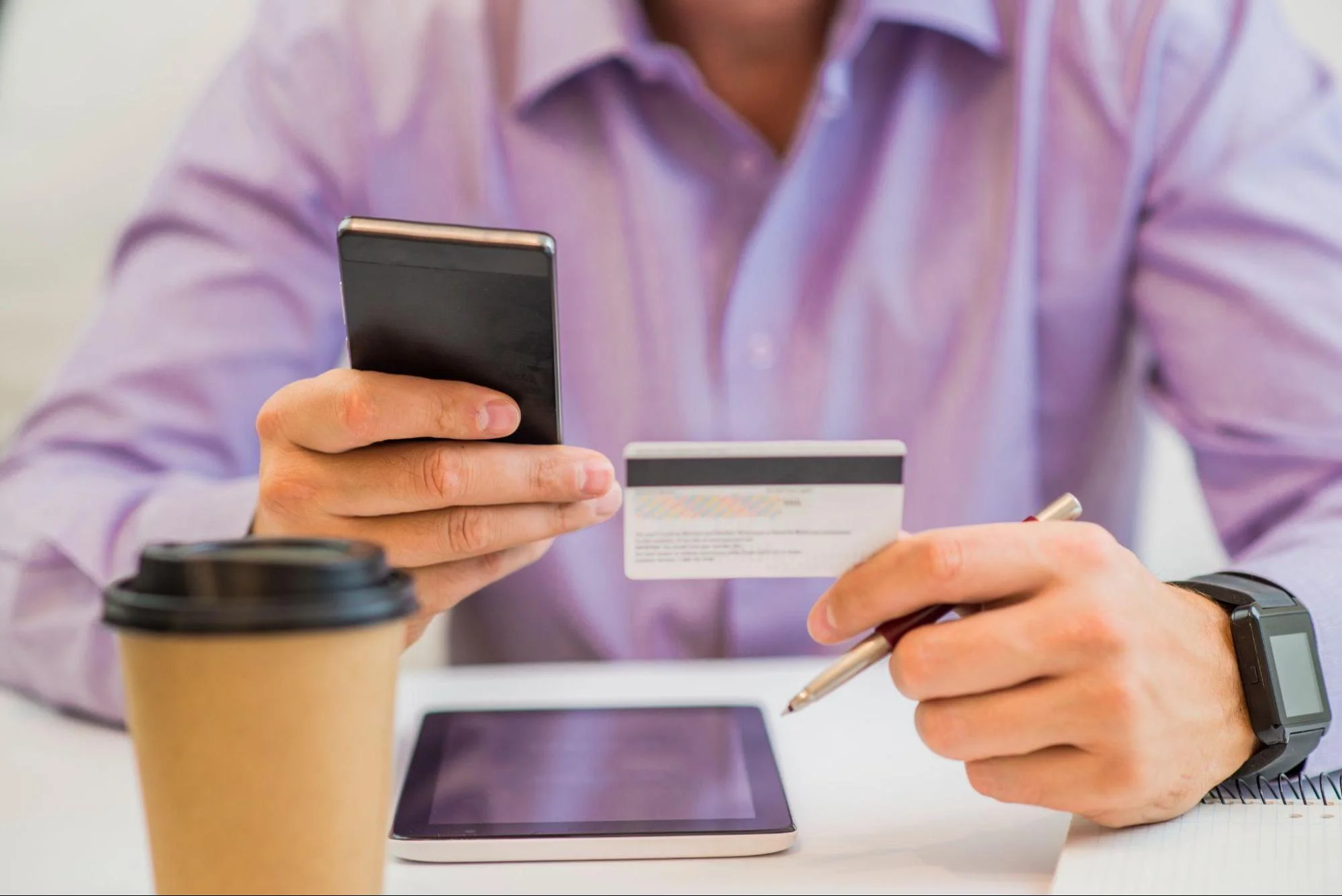 Man entering card details for secure online dating subscription payment